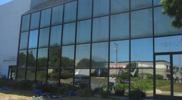 This is how performance glass, or exterior reflective glass, looks when neglected for years. Huntington Beach, CA