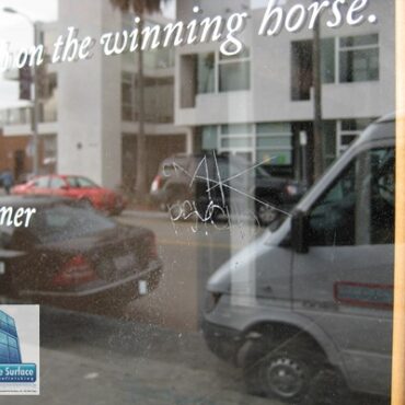 Scratched Glass Graffiti Removal - Before Grinding