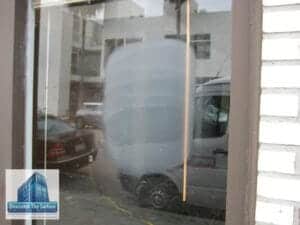 scratched glass graffiti removal - Polishing Santa Monica Storefront