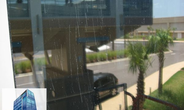 Closeup of scratches throughout tempered laminated hurricane window in biloxi MS
