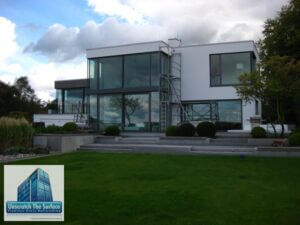 View of custom home in Europe in need of an expert window scratch remover. Kiel, Germany