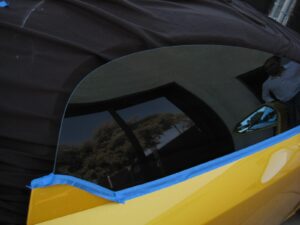 Polishing glass alone cannot fix scratched glass. Classic car. Newport Beach, CA