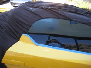 Fix glass scratches in classic car by sanding damage out. Newport Beach, CA