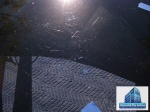 Multiple scratches in glass table top visible in sunlight in Bel Air, CA