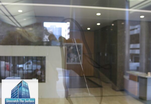 Welding Damage Glass Restoration close up welding damage in tempered glass century city ca
