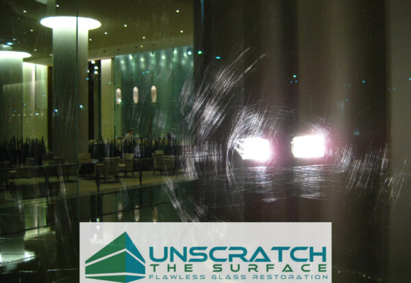 Close up scratches in tempered glass curtain wall widespread scratches from fabrication debris (glass fines) Queens NY
