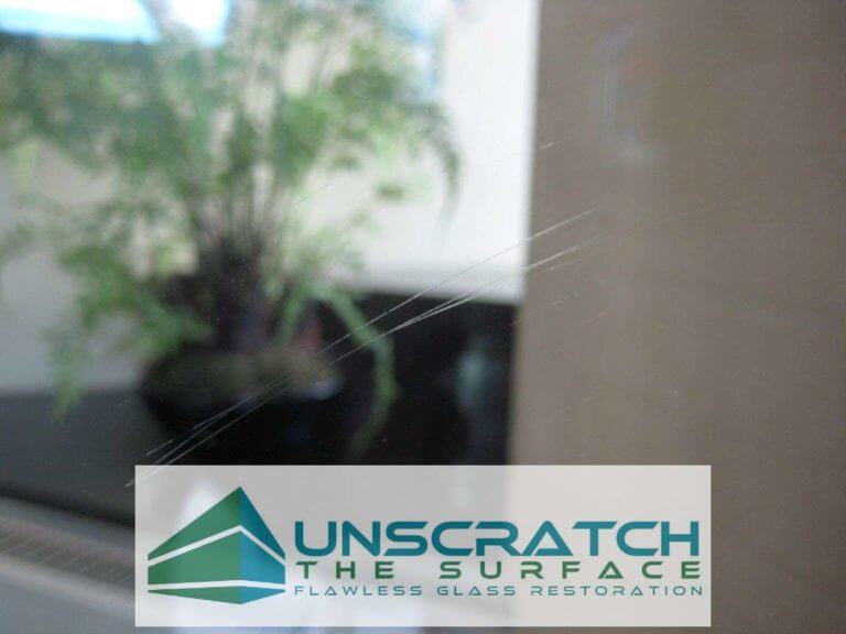 Closeup tempered glass scratches we encountered on Northcreek construction project in Denver, CO.