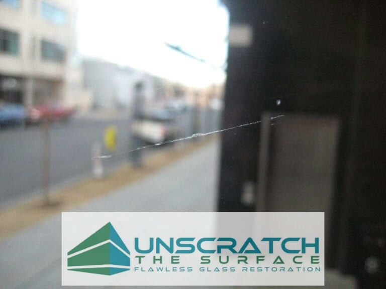 Closeup of sample glass scratch to be removed at Northcreek project in Denver, CO
